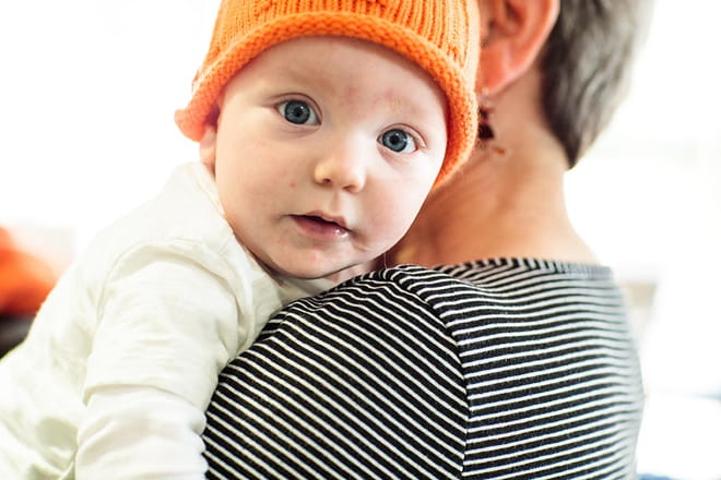 Baby on grandmothers shoulders