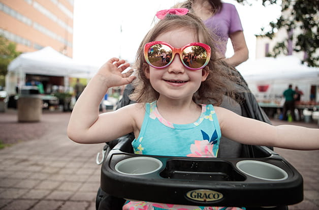 A smiling school bus driver