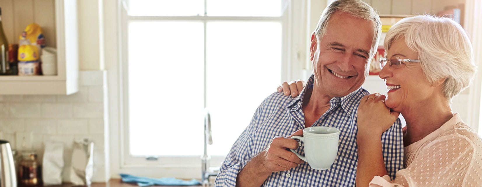 Couple drinking coffee and smiling