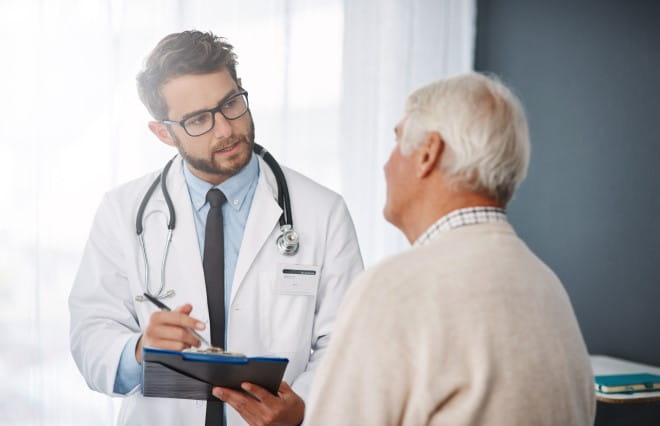 an image of a doctor talking to a patient