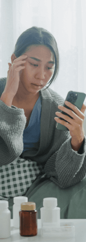 A woman checks her phone