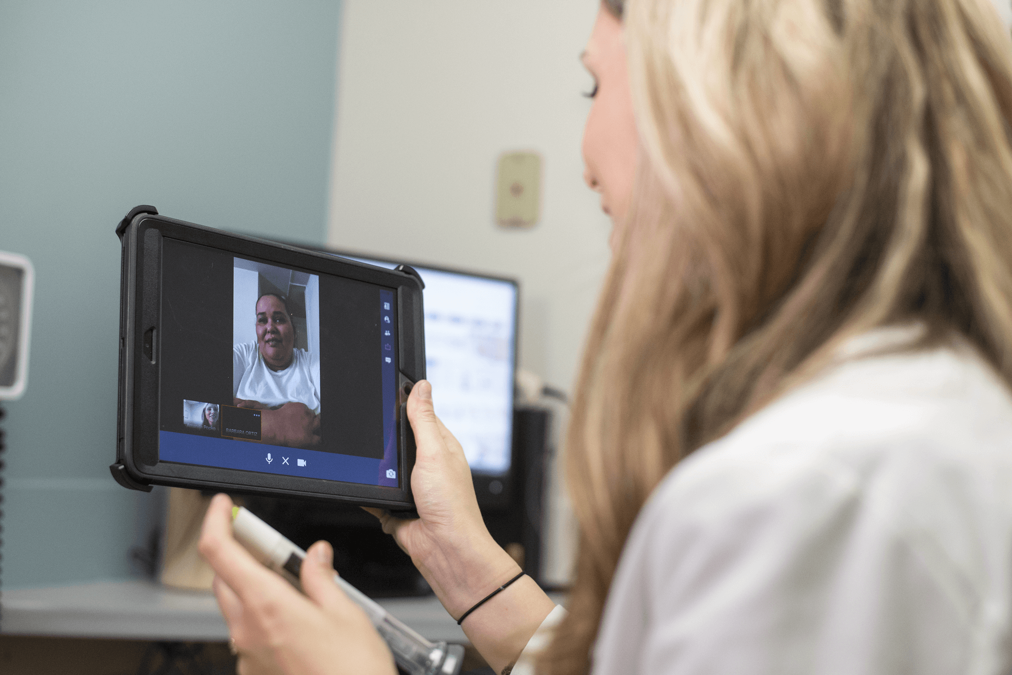 A doctor engages in a telehealth video call with a patient