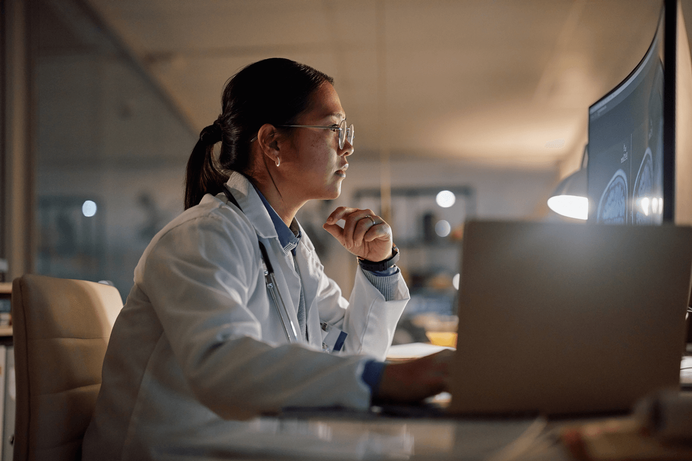 A doctor working on a computer