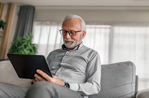 Older man on tablet