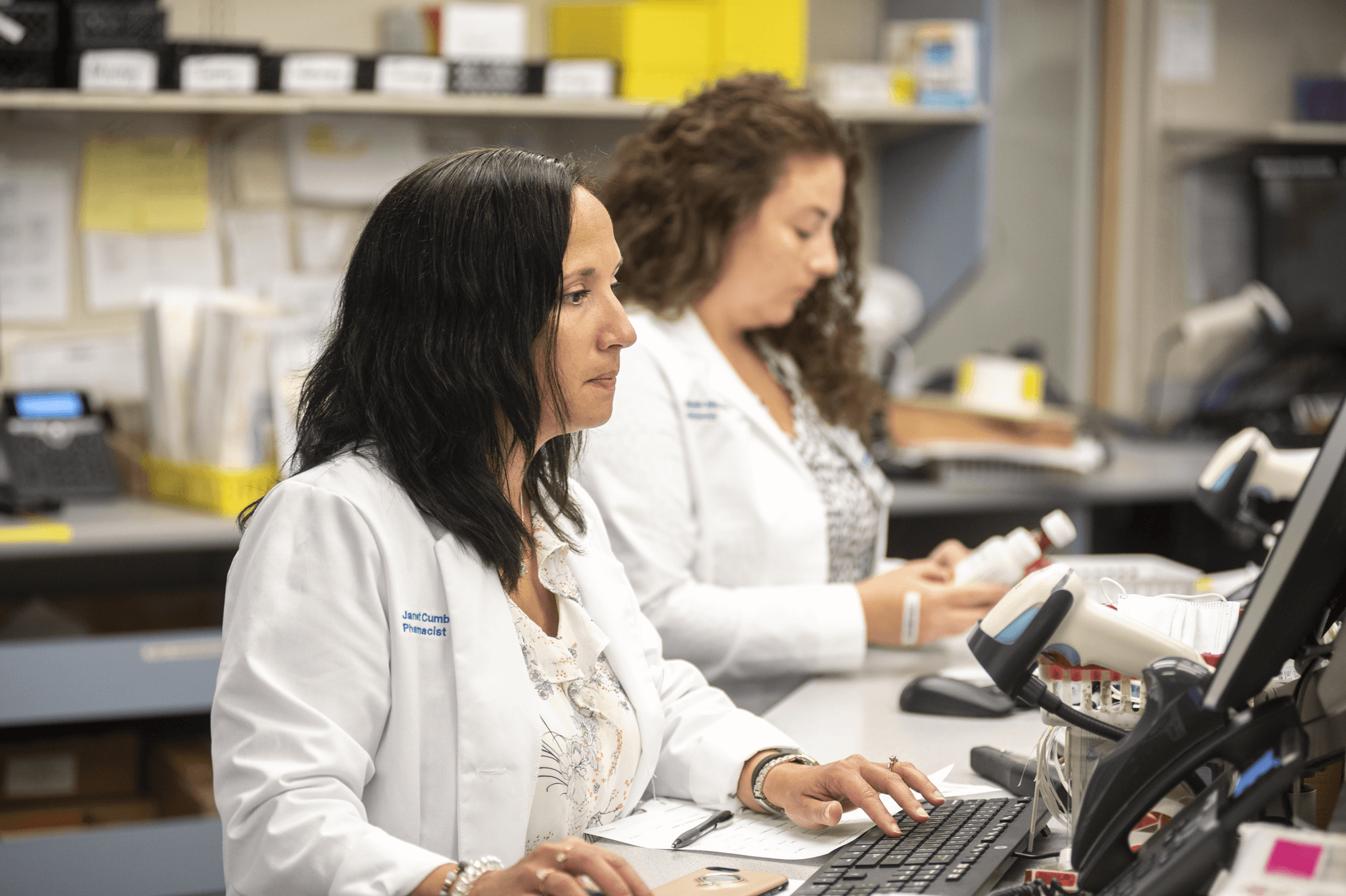 Doctors sitting behind a desk