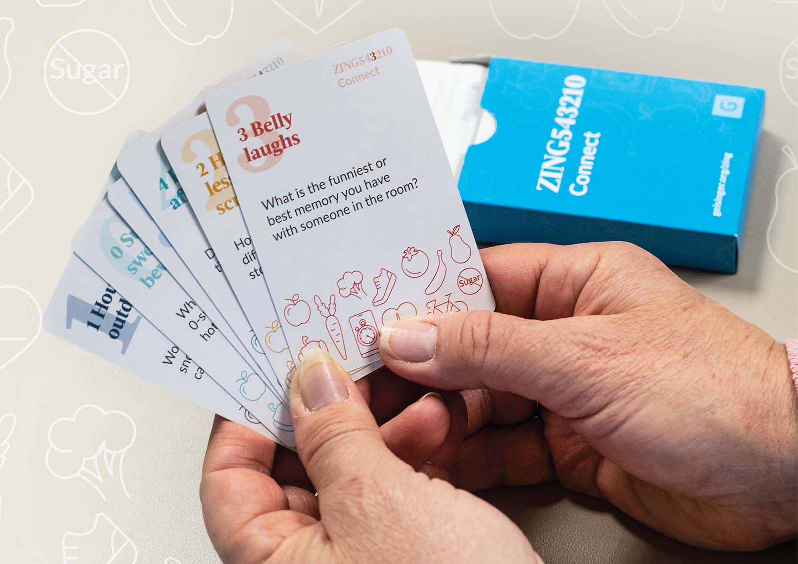 A person is taking part in a game featuring ZING543210 cards.